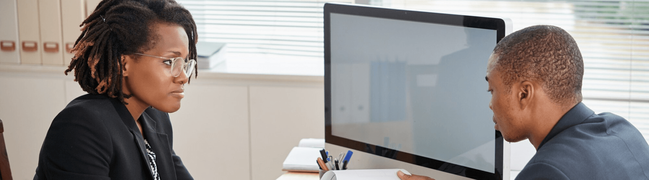Professionals collaborating at a desk